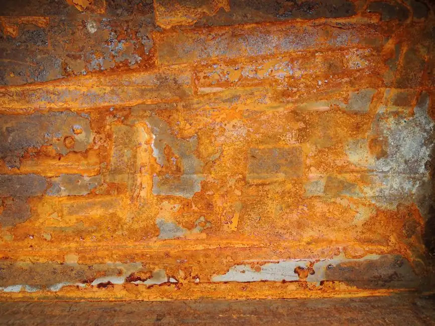 Corroded cast iron pipe surface close-up